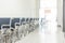 Blur abstract background view wheelchair seat row in empty hospital building interior