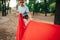 Blur abstract photo. Hiker ties a hammock to a tree in the woods. Active rest in the forest. Background. Copy space