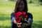 Blur Asian women giving red roses flower to her boyfriend on Valentine`s day