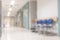 Blur background of empty indoor hospital interior in corridor lobby waiting area