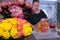 Blur background with florist packaging roses boquet in flower shop.