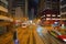 Blur background of tram or bus view at night. Crowd of people on street of Central district. Transportation for tourists visiting