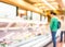 Blur background of woman customer select fresh product on shelf