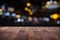 Blur cafe restaurant or coffee shop empty of dark wood table with blurred light gold bokeh abstract background for montage product