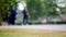 Blur footage people jogging in park.