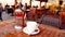 Blur image or defocus of customer in coffee shop. Blurred picture of interior of large beautiful restaurant with bright