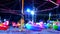 Blur multi color of ferris wheel and rolling neon light in night market fair