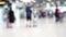 Blur of passenger moving in duty free shop