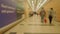 Blur of people in corridor with shops in airport