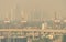 Blur photo of cityscape with polluted air. Air pollution. Smog and fine dust of pm 2.5 covered city. Dirty environment.