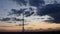 Blur silhouette of communication tower with dusk cloudscape skyline
