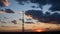 Blur silhouette of communication tower with sunset cloudscape skyline