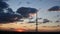 Blur silhouette of communication tower with sunset cloudscape skyline