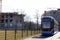 Blur, the tram goes on rails in the alley of trees. eco-friendly urban public transport. urban forestry, protection of the