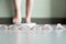 Blured of women foot standing on weigh scales with tape measure in foreground