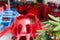 Blurred abstract background of outdoor cafe. Colourful tables and chairs in a cafe. Yellow, blue, red colors. Outdoor European
