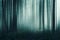 A blurred abstract edit of a spooky forest on an atmospheric misty winters day