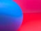 Blurred abstract photo with half  blue sphere/ball on red/pink background