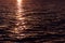 Blurred abstracted sun flare, sunset light on water surface