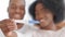 Blurred afro american couple ethnic black young family curly woman and man smiling showing positive pregnancy test