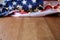 Blurred American flag and garland on wooden table