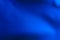 Blurred background in blue. Defocused paper abstract texture