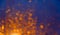 Blurred background with bokeh orange lights on dark blue background