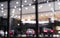 Blurred background with car dealership exterior. Abstract blurred photo of modern building motor showroom. Blur car show room