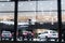 Blurred background with car dealership exterior. Abstract blurred photo of modern building motor showroom. Blur car show room