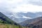 Blurred background with the cloud-covered mountain peaks of Apurimac river valley, Peru