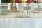 Blurred background. Food court. White chairs