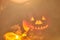 Blurred background Halloween .Jack.Blurred glowing jack lantern carved from a pumpkin for Halloween with a burning candle close-up