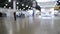 Blurred background. Inside big empty building with high ceiling.