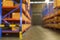 Blurred background of Inventory full of shelves in modern warehouse storage of retail shop