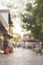 Blurred background with low houses and a footpath. Small southern town.