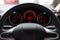 Blurred background with Modern Car dashboard modern automobile control illuminated panel.Car Driving. Vehicle Steering Wheel