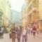 Blurred background with people strolling in the city