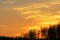 Blurred background of a Summer landscape with multicolored sunrise. Beautiful blur landscape with golden sunset.