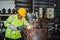 Blurred background of worker is working electric wheel grinding on steel structure in factory