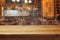 Blurred bar interior and wooden counter