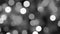 Blurred black and white abstract  New Year 4k video bokeh of blinking defocused holiday lights