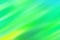 Blurred blue background with green and yellow diagonal stripes