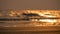 Blurred and bokeh background with sea wave and sand beach on twilight.