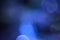 Blurred, bokeh blue lights background. Abstract sparkles