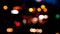 Blurred bokeh of cars in traffic on the road at night. Abstract bright blurred colored bokeh.