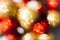 Blurred bokeh with golden and red balls. Abstract festive background.