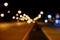 Blurred bokeh lighting on the road.
