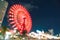 Blurred bokeh night harbor lights background with ferris wheel