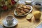 Blurred breakfast with homemade cheesecakes, tea and raspberry jam