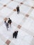 Blurred Business People Walking On Tiled Floor